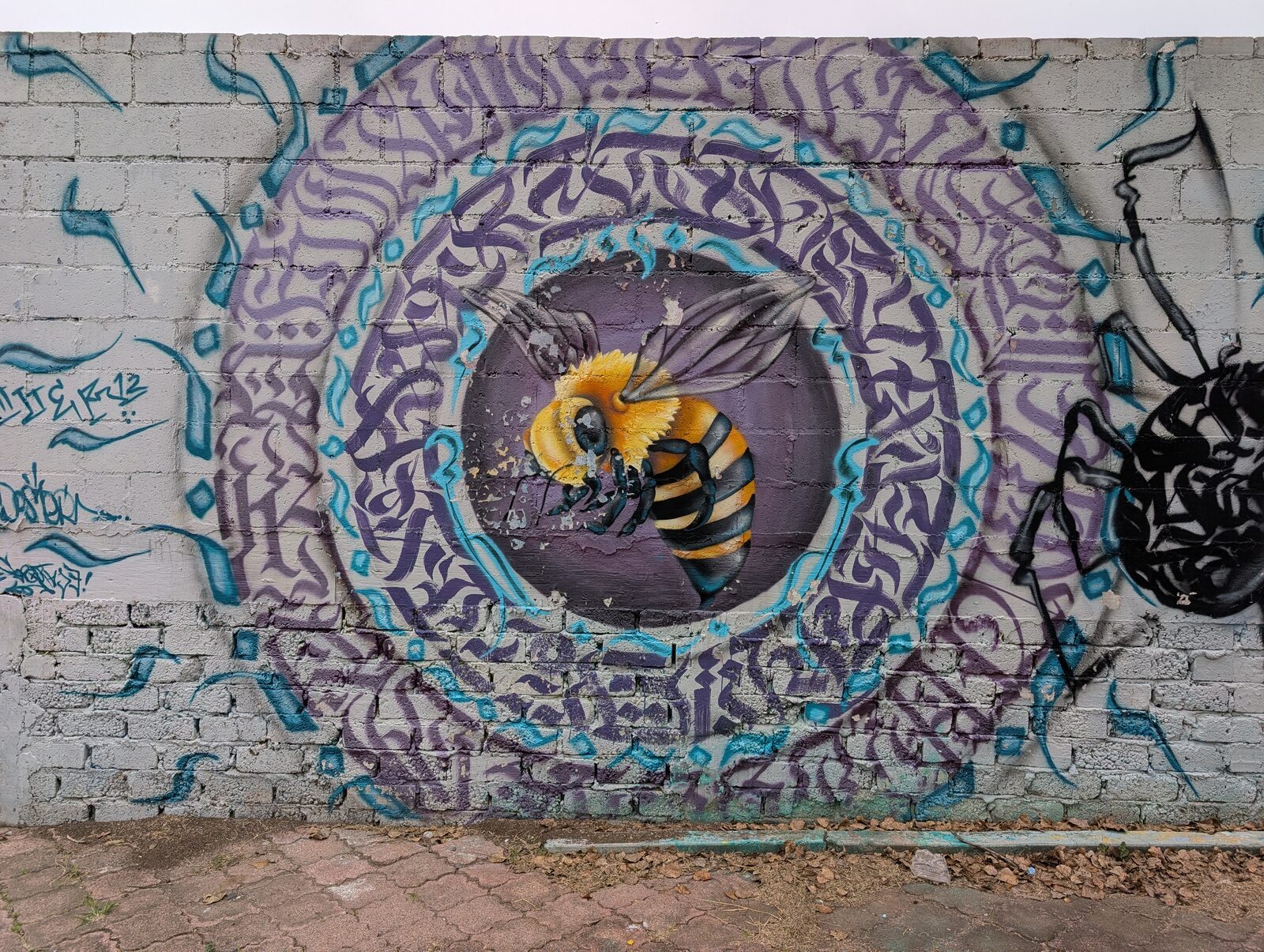 Bee in a calligraphy mandala