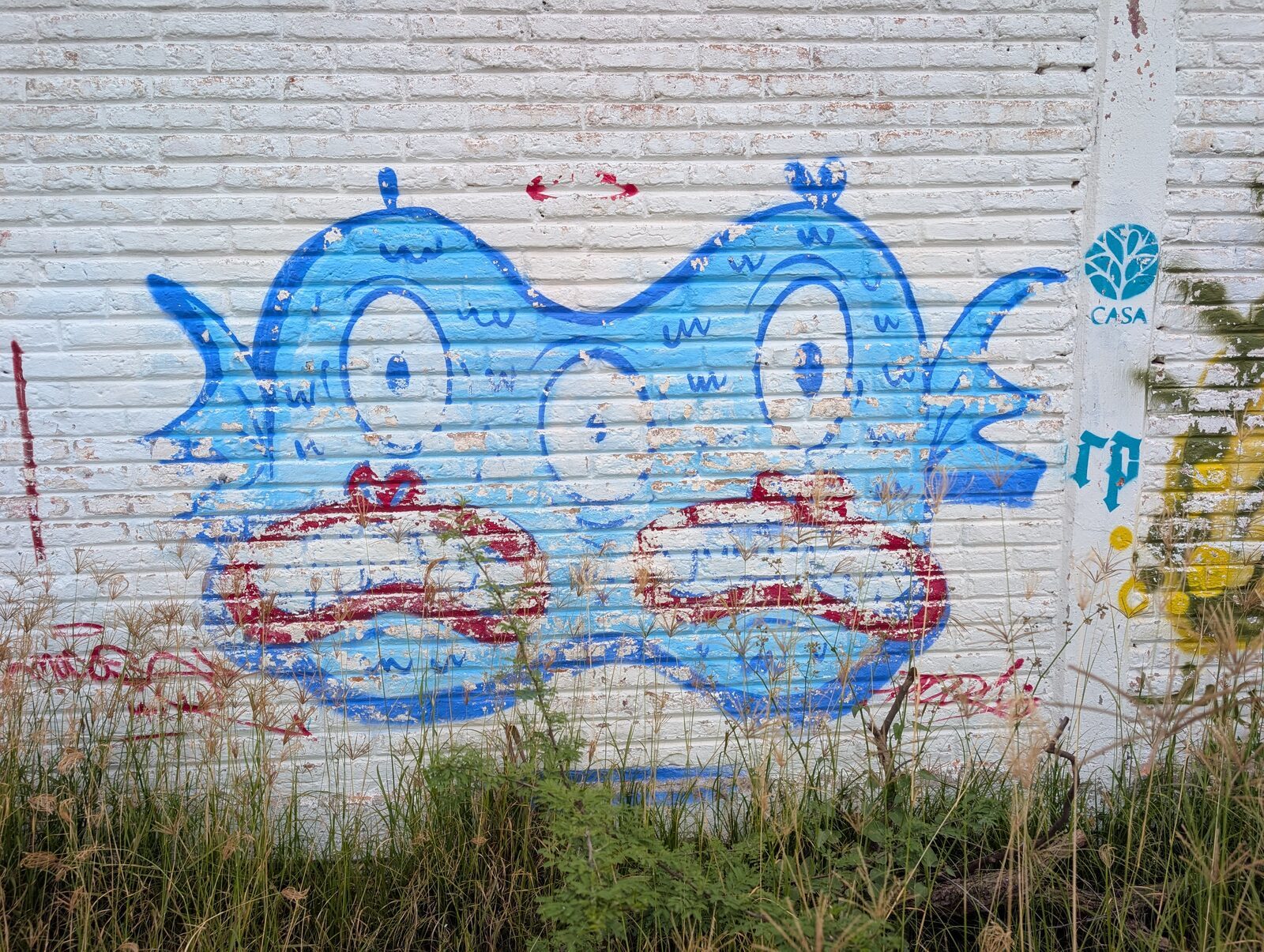 Three-eyed blue creature