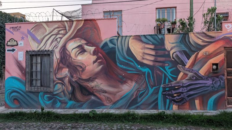 Reclining woman with skeletal hand