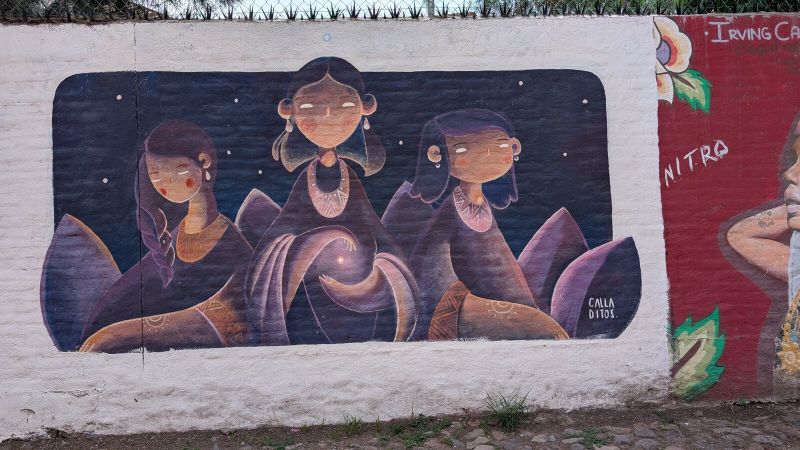 Three women and orb