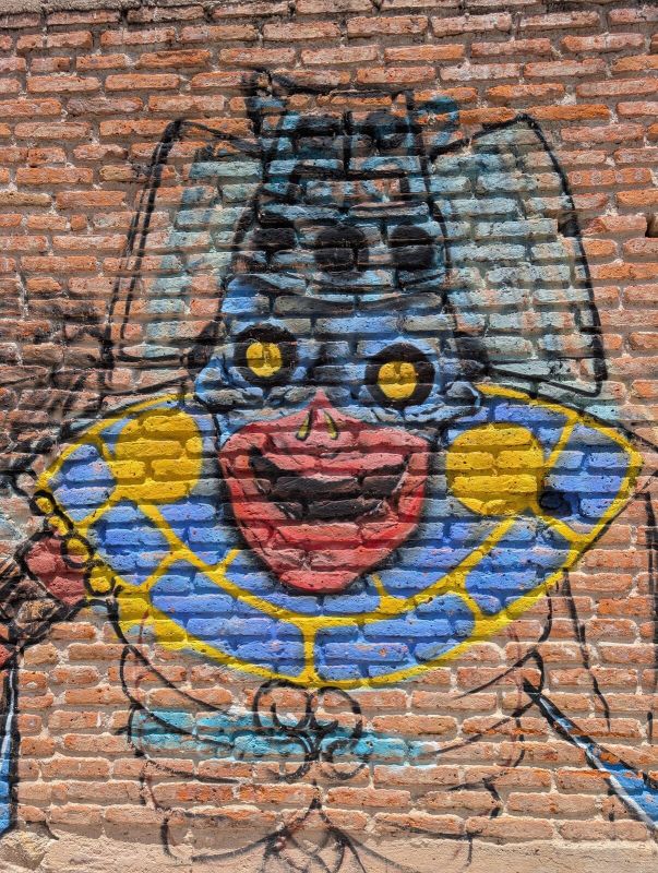 Grinning blue figure