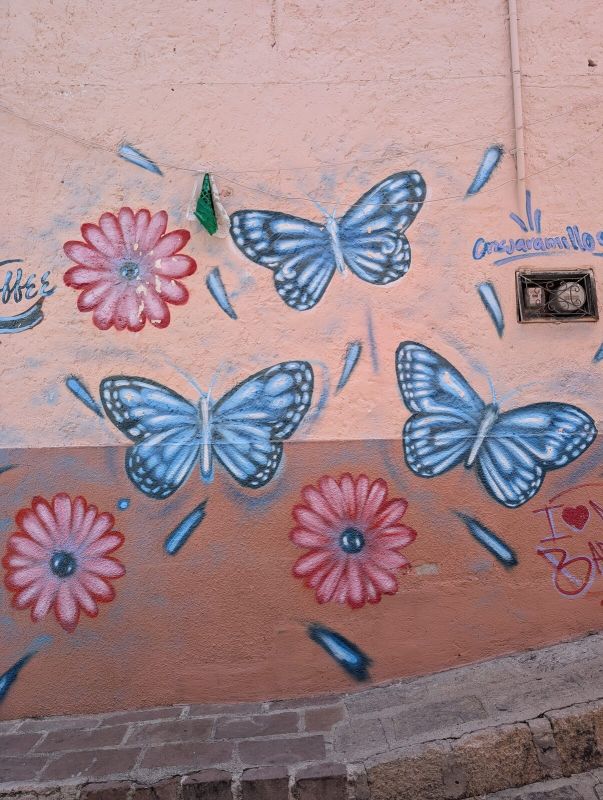Blue butterflies and daisies