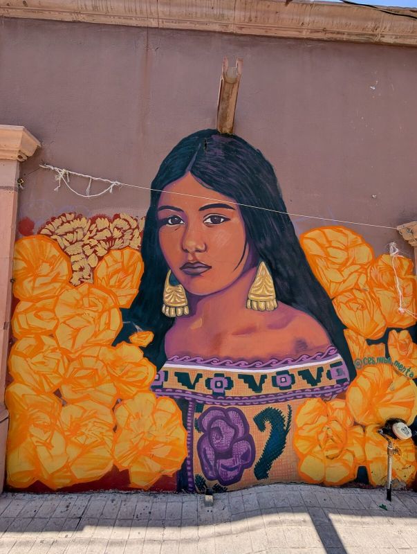 Woman among marigolds