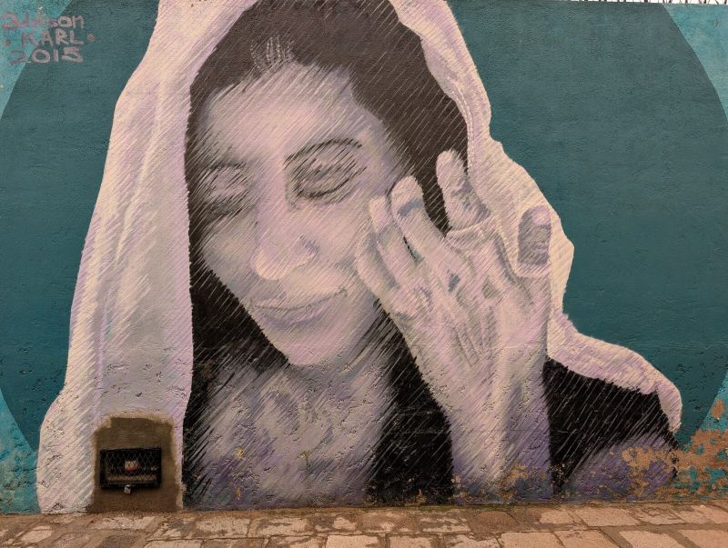 Veiled woman resting