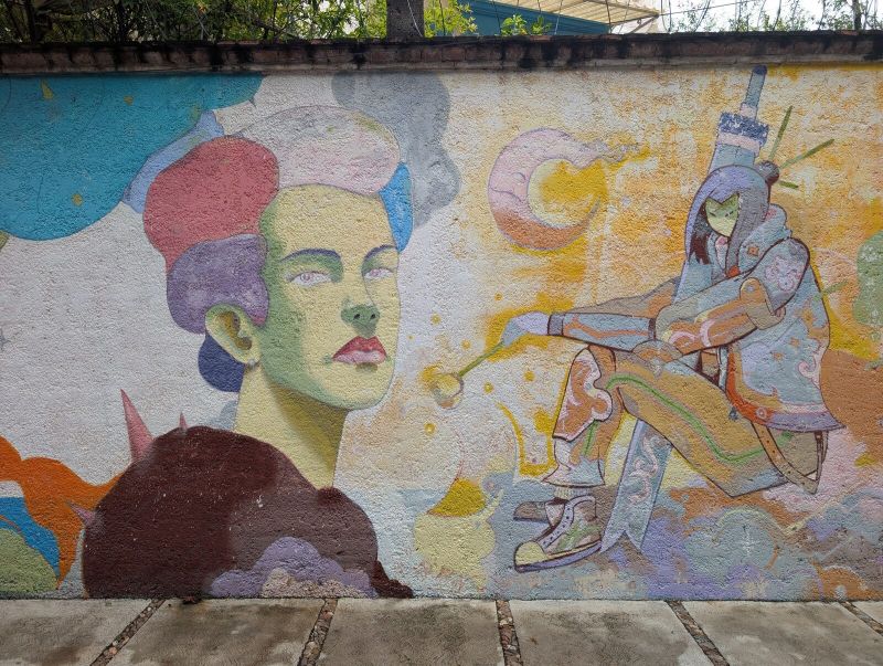Green-faced woman and swordsman