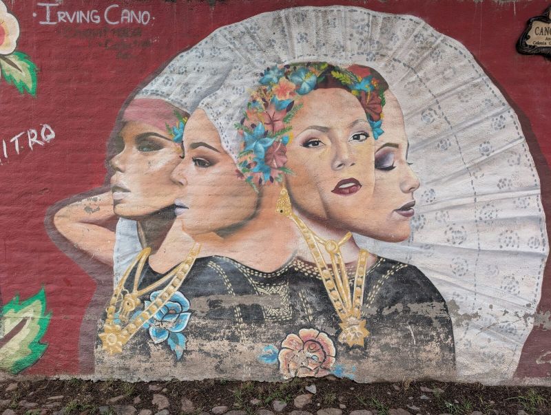 Three women and a fan