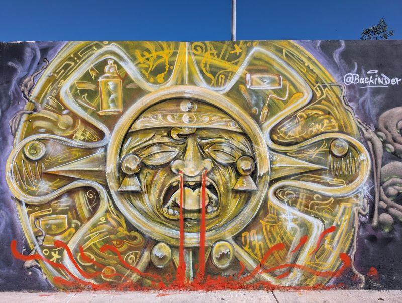 Aztec sun stone of spray cans