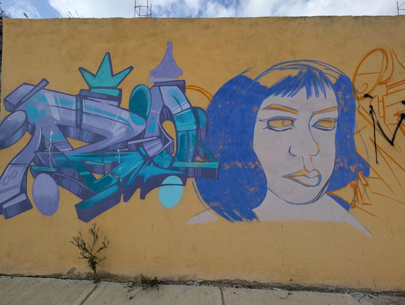 Blue-haired woman and wildstyle piece