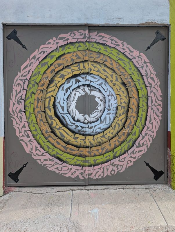 Calligraffiti mandala on gate