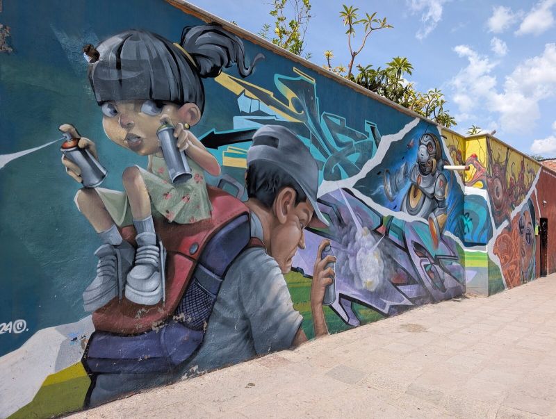 Kids spraying, robot and eye-creature