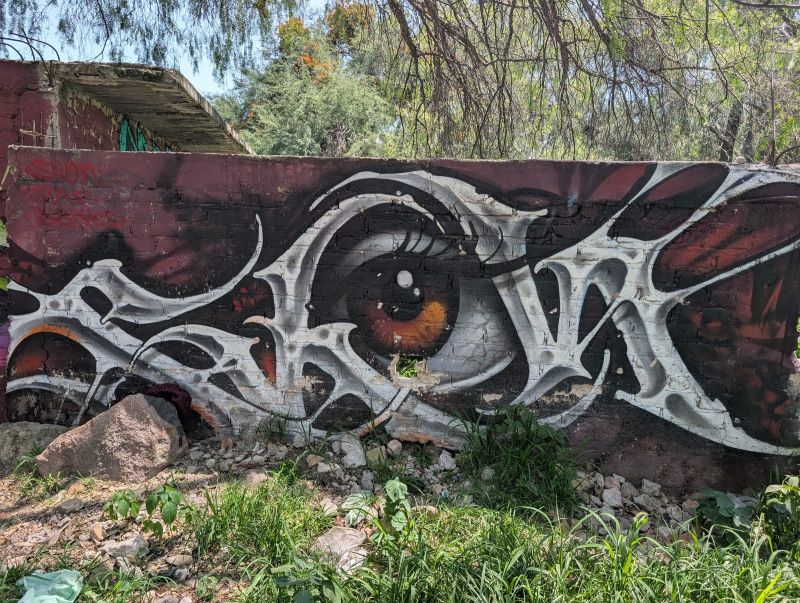 Eye among silver letters