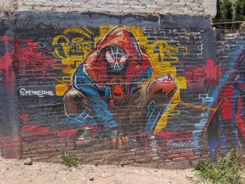 Crouching masked superhero