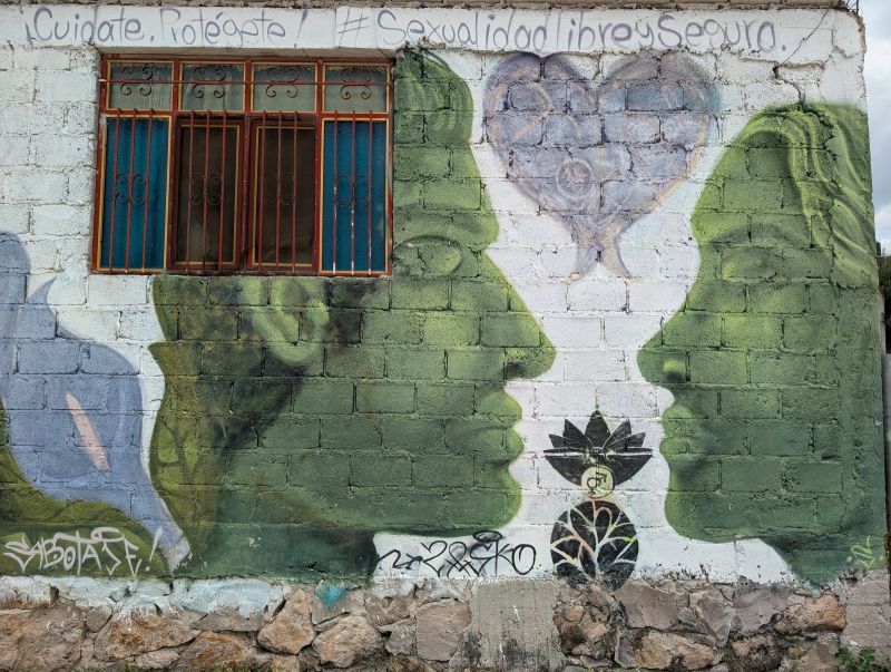 Two profiles and a heart