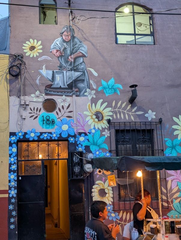 Blacksmith among flowers